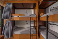 Bunk Bed in Female Dormitory Room with Curtain
