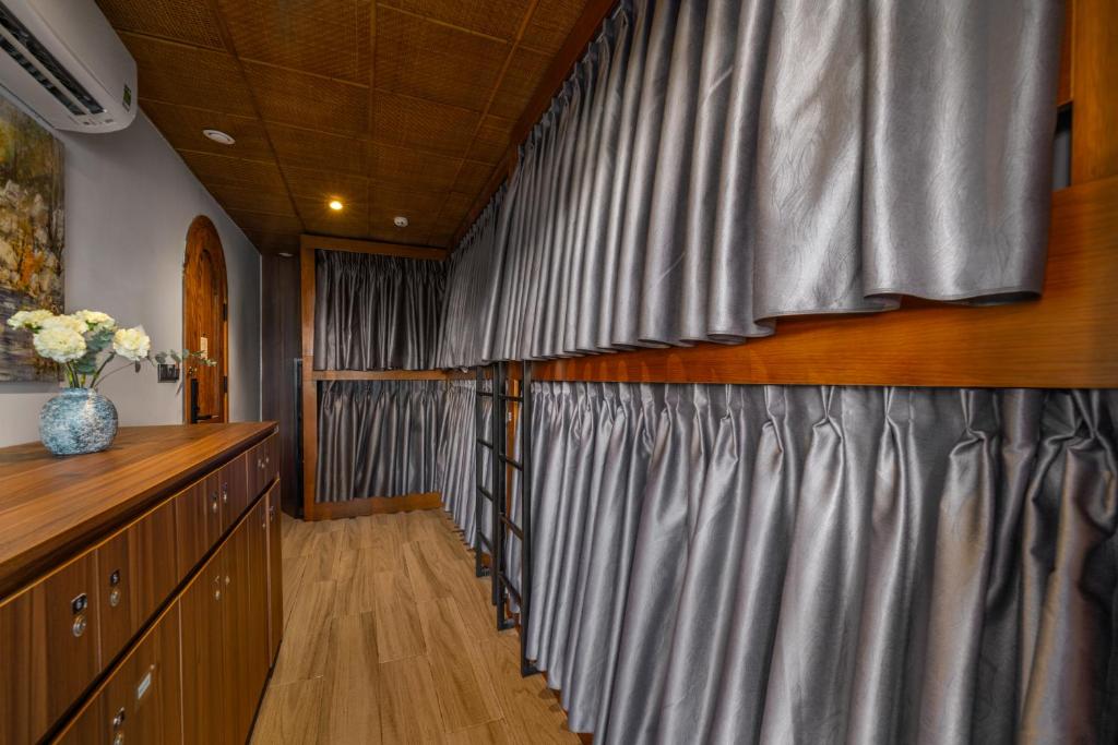 Bunk Bed in Female Dormitory Room with Curtain