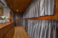 Bunk Bed in Female Dormitory Room with Curtain