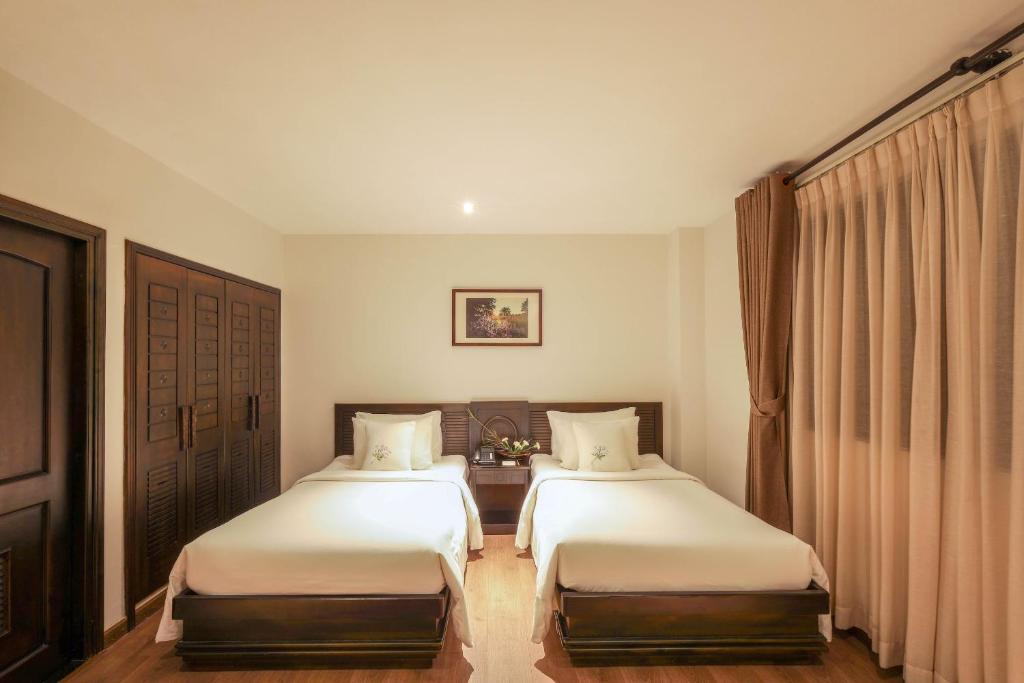 Phòng Premier 2 Giường Đơn có minibar miễn phí