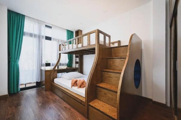 Two-Bedroom Family Suite, Bathtub, Kitchen and Balcony with Street & City View